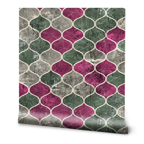 Wallpaper with geometric arabesque pattern in shades of gray, green, and magenta with stone texture