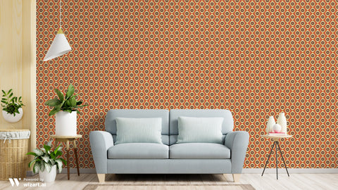Living room with a gray sofa against a patterned orange and brown wall.