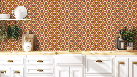Kitchen with white cabinets, wooden countertop, and orange patterned wallpaper.