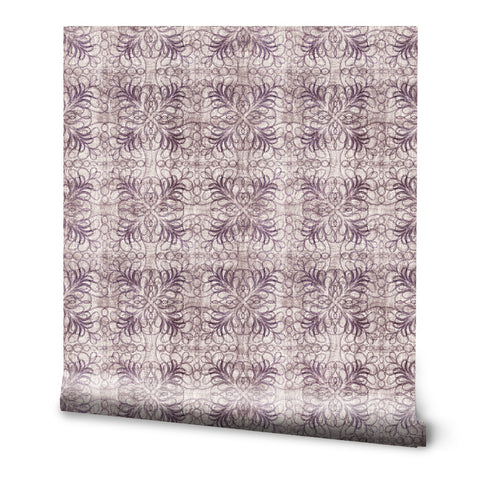 Roll of wallpaper with abstract web-like purple floral pattern on beige background