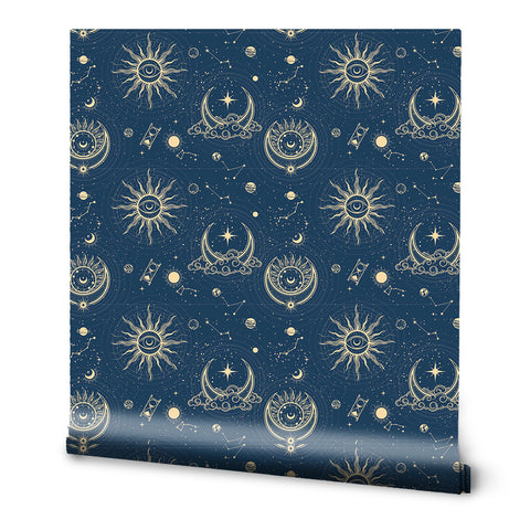 A roll of dark blue wallpaper with a pattern featuring celestial bodies such as moons, stars, and suns.