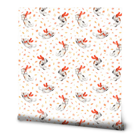 A roll of wallpaper with a pattern featuring stylized rabbits and leaves in orange and white colors, indicative of autumn.