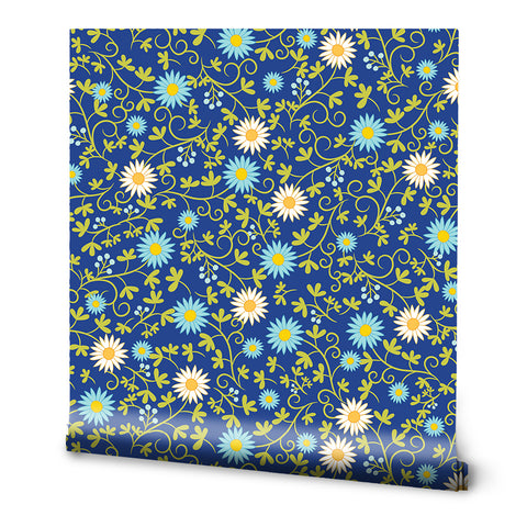 A roll of wallpaper with a floral pattern featuring blue, green, and white colors.
