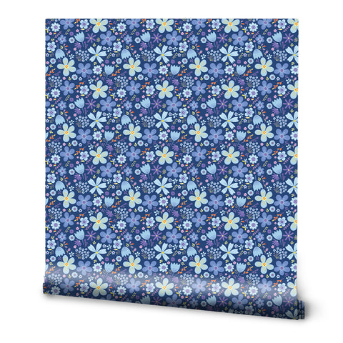 A roll of wallpaper with a blue and purple floral folk design.
