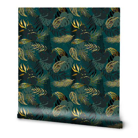 A roll of wallpaper with a tropical leaf pattern in various shades of green and gold.