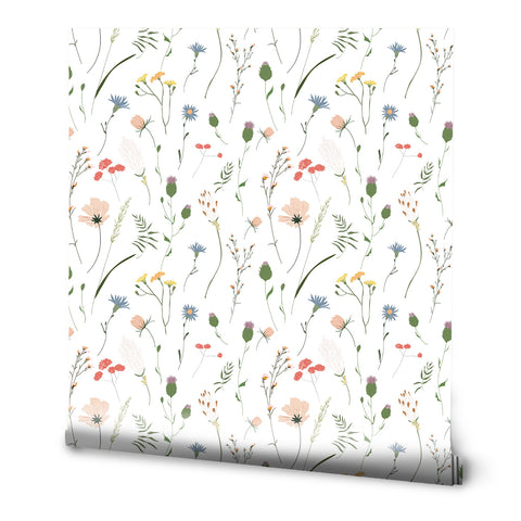 Roll of floral wallpaper with a pattern of various meadow flowers.