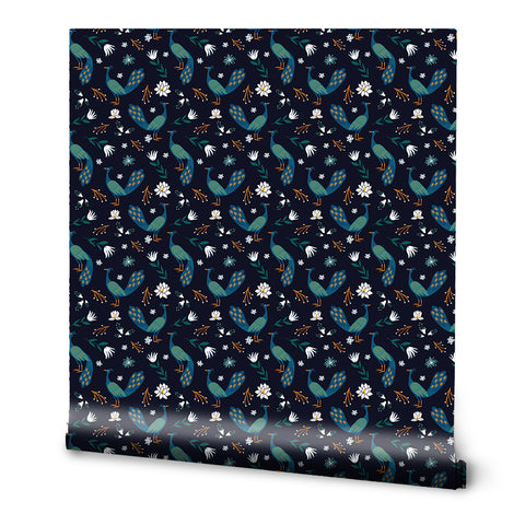 A roll of removable wallpaper with a dark blue background featuring a floral pattern with peacocks and other birds.