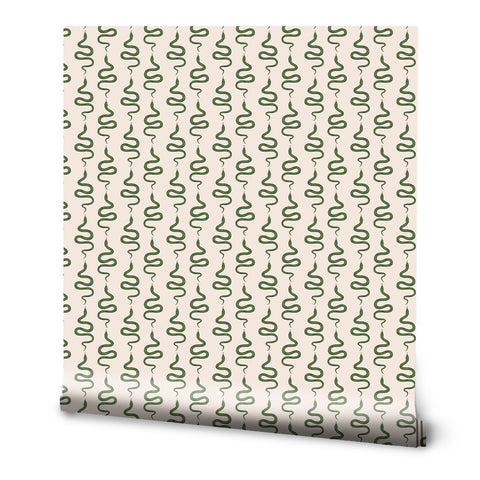 A roll of removable wallpaper with a bold, geometric serpentine design in green on a beige background.