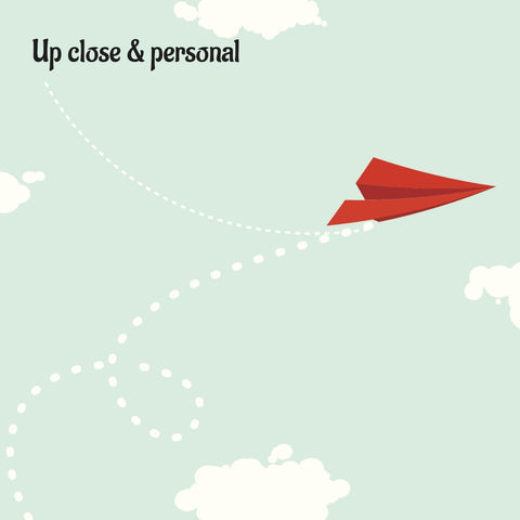 removable wallpaper with a pattern of red paper planes flying against a light blue background with white clouds.