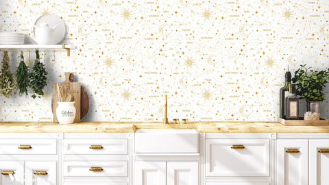 removable wallpaper with a white and gold celestial pattern featuring zodiac star signs.