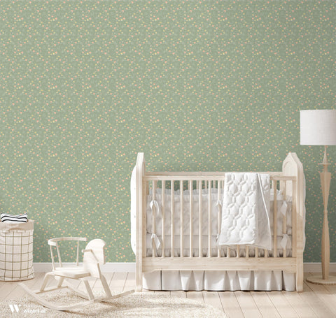 wallpaper with a green background featuring a pattern of floral and bunny motifs in pink and yellow.