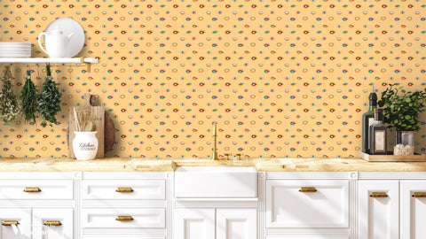 wallpaper with a pattern of various colorful eyes on a yellow background.