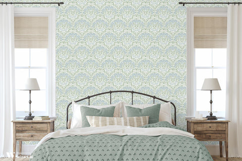 wallpaper with a delicate green and blue floral pattern.