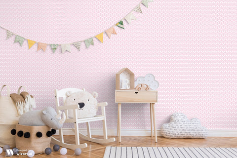 Soft pink ornamental wallpaper displayed in a children’s room with wooden furniture and playful pastel decorations.