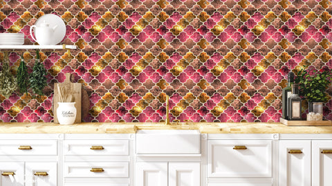 Kitchen with Moroccan tile wallpaper in copper, red and brown geometric pattern above white cabinets and wooden countertop