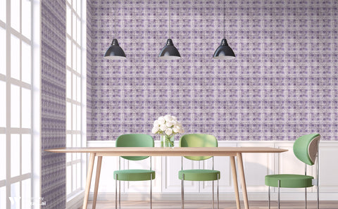 Dining room with abstract purple floral wallpaper, wooden table, green chairs, and black pendant lights