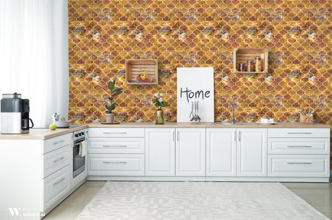 Modern kitchen with white cabinets and wooden countertop against wallpaper featuring geometric quatrefoil pattern in gold, orange, and brown stone texture
