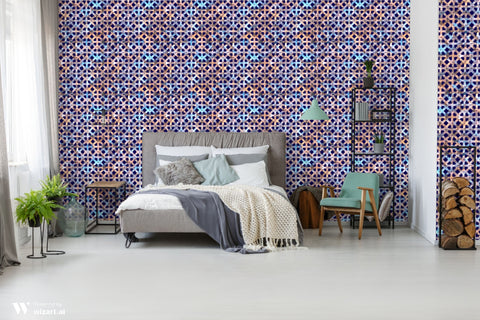 Bedroom with gray bed and modern decor against wallpaper featuring geometric lattice pattern in blue, bronze, and purple on dark navy background