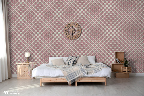 Bedroom with red and beige diamond patterned wallpaper, wooden bed, nightstands and wall clock above the headboard