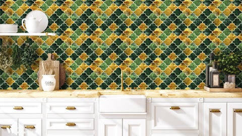 Kitchen interior with Moroccan tile wallpaper in green, gold and grey geometric pattern behind white cabinets