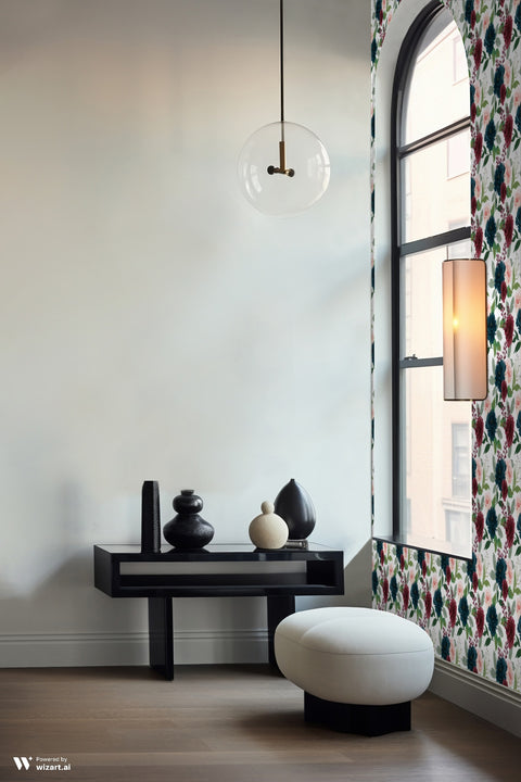 Watercolor floral wallpaper with navy, burgundy, and blush flowers around an arched window in a modern minimalist sitting area.