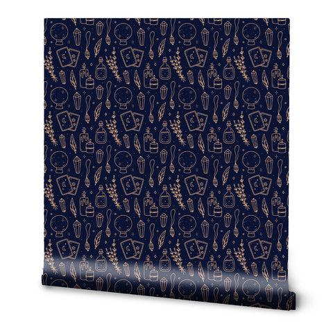 A roll of removable wallpaper with a pattern featuring tarot cards, potions, and other mystical symbols on a dark blue background.