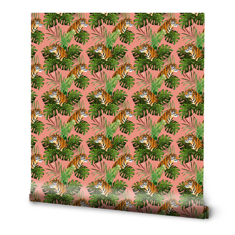 A roll of removable wallpaper with a tropical design featuring tigers among green leaves on a pink background.