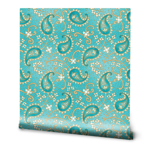A roll of turquoise paisley removable wallpaper with a rich pattern of blue and white.