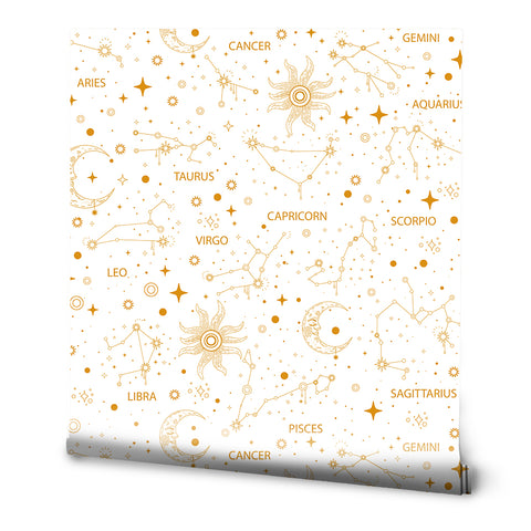 A roll of removable wallpaper with a white and gold celestial pattern featuring zodiac star signs.