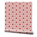 Wallpaper with geometric red and white pattern featuring repeating triangular floral shapes