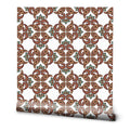 Wallpaper with traditional paisley-inspired floral pattern in red, brown, and green on a white background