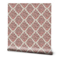 Roll of wallpaper with Arabian textile inspired pattern in red and beige diamond design