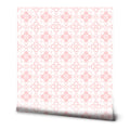 Pink and white wallpaper with a repeating heart and floral motif arranged in circular geometric patterns, suitable for bedrooms or children’s rooms.