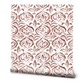 White wallpaper with red damask floral pattern in classic ornamental design
