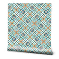 Wallpaper with Mediterranean tile-inspired pattern in blue, turquoise, and terracotta geometric design