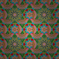 Colorful geometric pattern with pink, green, and blue shapes on a dark background