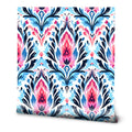 Vibrant floral wallpaper featuring pink, blue, and navy design, ideal for living room or bedroom walls.