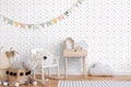 removable wallpaper with a pattern of fluffy clouds, shining stars, and charming moons in various colors on a white background.