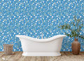  floral wallpaper with a blue background and white daisy patterns.