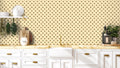  removable wallpaper with a pattern of yellow bees on a beige background.