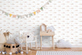 circus-themed wallpaper with a pattern featuring clowns, bicycles, and stars.