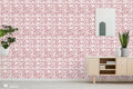 Living room interior with red and white damask wallpaper, wooden sideboard, plants and wall art