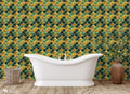 Bathroom with freestanding white bathtub and Moroccan tile wallpaper in green and gold geometric pattern