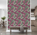 Hallway with decorative bench and wooden flooring against wallpaper featuring geometric arabesque pattern in gray, green, and magenta with stone texture