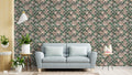 Living room with light gray sofa and plants against wallpaper featuring geometric quatrefoil pattern in green, beige, and gray stone texture
