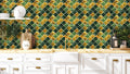 Kitchen interior with Moroccan tile wallpaper in green, gold and grey geometric pattern behind white cabinets