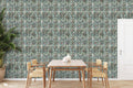Dining room with wooden table and chairs against wallpaper featuring abstract damask pattern in blue, beige, and black