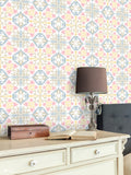 Pink and blue floral wallpaper design used in a cozy bedroom or study room with classic wooden furniture