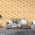 Living room with gray sofa and wooden coffee table against beige wallpaper with orange floral design
