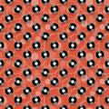 wallpaper with a retro pattern featuring black and white records on an orange background.